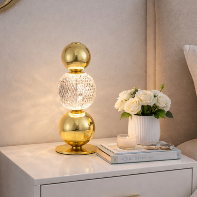Złota lampa stołowa Ponce z kulami